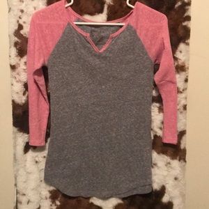 Woman’s small pink and gray baseball t